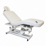 White adjustable medical examination chair with a cushioned backrest, leg rest, and a remote control on the seat for positioning.
